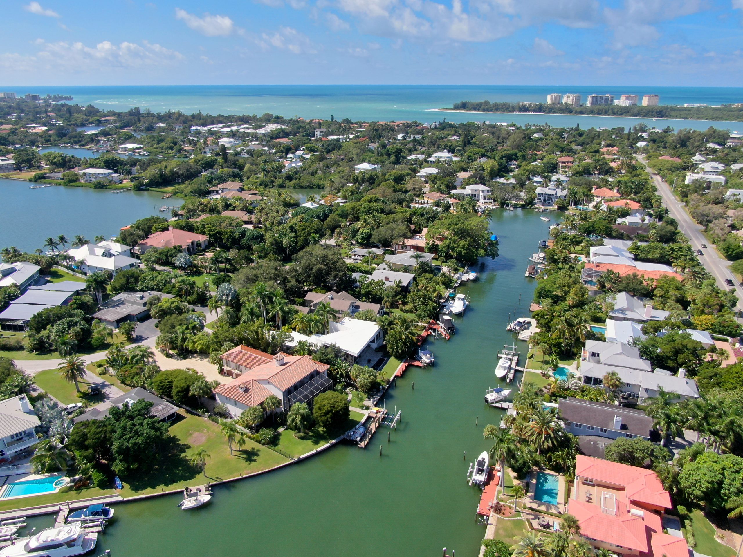 Aerial view of Bay Island neighborhood, luxury villas and boat, in Sarasota, Florida, USA